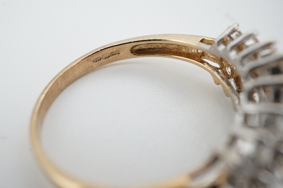 A modern yellow metal (stamped 585) and cubic zirconia set line bracelet, 18cm and a pair of similar drop earrings, together with a similar 9k and cubic zirconia set cluster ring, size N.